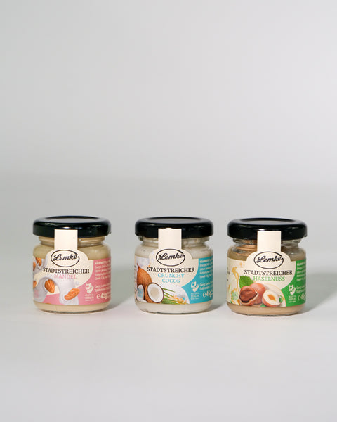 Lemke mini Stadtstreicher set with Mandel, Crunchy Cocos and Haselnuss spread jars on a white background