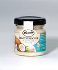 Lemke Stadtstreicher Crunchy Cocos Mini im Glas, 45g Kokoscreme, Frontansicht auf hellem Hintergrund