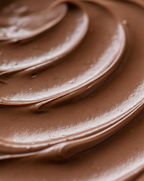 Close-up of creamy Lemke Nuss Nougat chocolate hazelnut spread texture