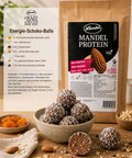 Lemke Mandel Protein with homemade chocolate energy balls, oats, dried apricots, and a recipe card for protein-rich snacks.